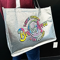 photo of a direct to film print applied to a metallic tote bag